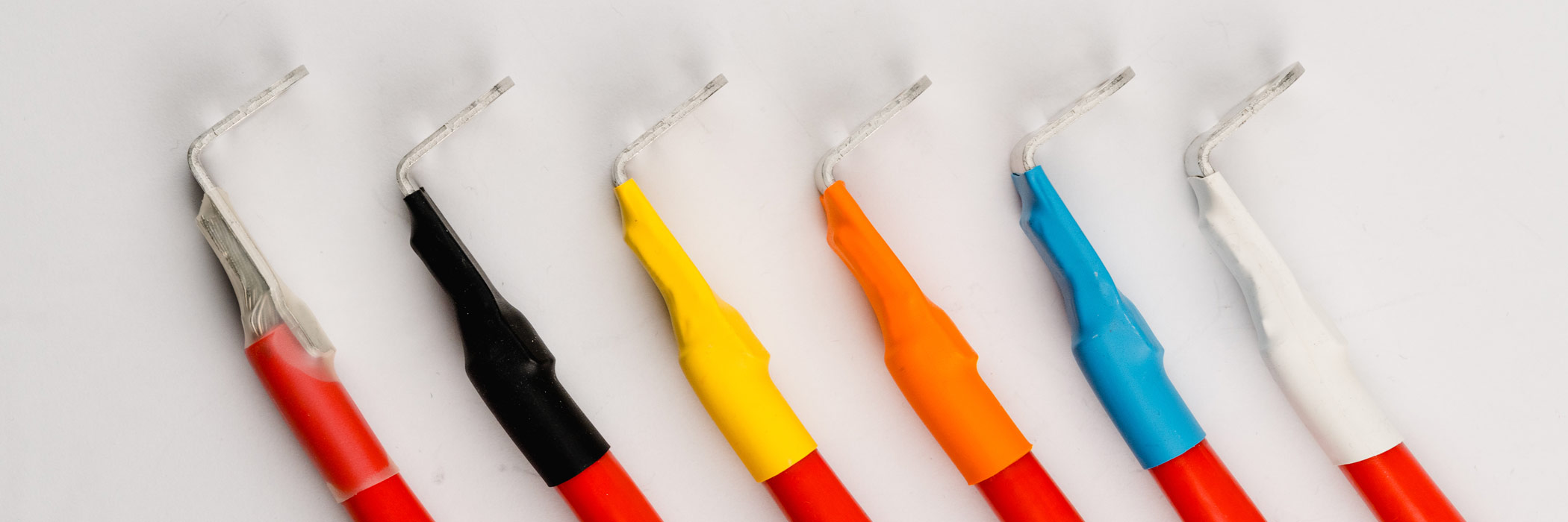 Heat shrink tubes in clear, black, yellow, orange, blue and white color